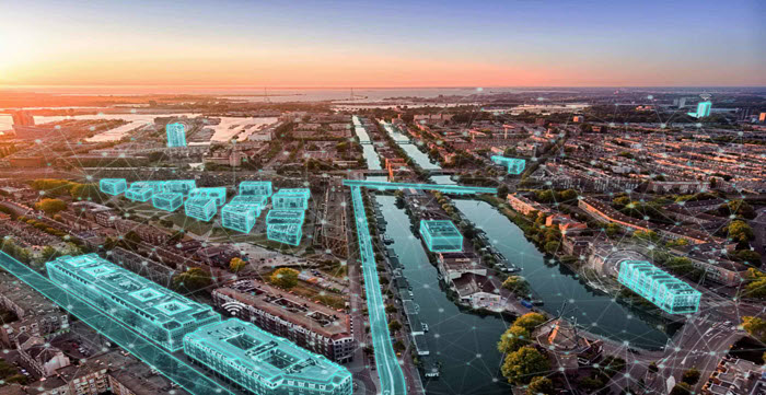 Aerial view of a cityscape with digital overlays highlighting buildings and infrastructure. A canal runs through the center, and the sun sets over the horizon.