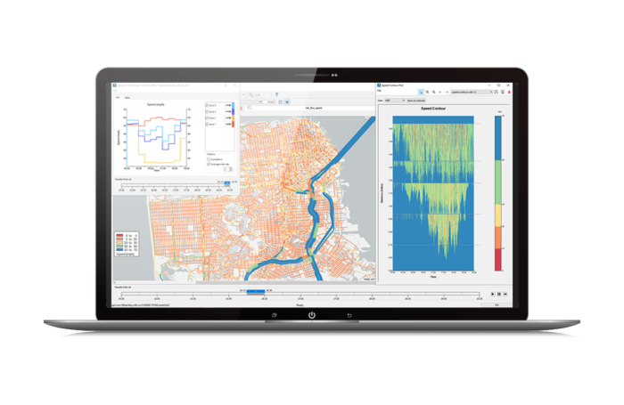 A laptop displaying a geographic information system (GIS) interface with maps, graphs, and data visualizations.